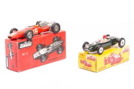 2 scarce Solido single seater racing cars. Lotus F1 in dark green, RN3, driver with red helmet. Plus