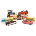 4 Corgi Toys. Jaguar Mark X (238), an example in cerise with yellow interior with luggage in boot.