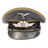 A Third Reich Luftwaffe Flight Section NCOs peaked cap, with metal insignia, golden yellow piping,