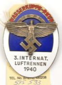 A Third Reich NSFK large oval enamelled badge, the centre with silvered Icarus device, above which