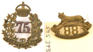 An officer’s cap badge of the 75th Lunenburg Regt, and a collar of the 88th Regt (Victoria Fus)