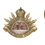 An officer’s gilt cap badge of the 31st British Columbia Horse, red enamel centre backing. GC