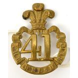 An OR’s 1874 pattern brass glengarry badge of The 41st the Welsh Regt, scrolls joined (493),