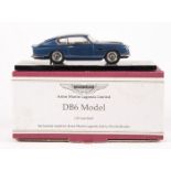A 1:43 scale white metal model by Illustra Models. An Aston Martin DB6 in dark metallic blue,