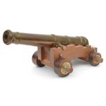 A well made modern model naval cannon, brass barrel 12” of good form (not bored through), on its 4