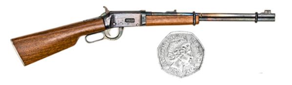 A well engineered non working miniature model of an 1876 Winchester carbine, 6” overall, with