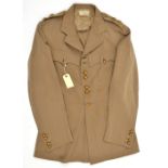 A Lieutenant’s khaki 4 pocket tropical tunic of the Coldstream Guards, buttons in pairs to chest and