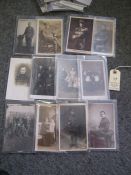 14 WWI monochrome postcards of individuals, mostly infantry men in service dress; 4 of family groups