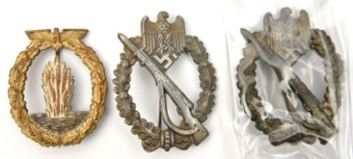A Third Reich infantry assault badge, solid back, another die struck, a mine sweeper submarine