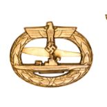 A Third Reich U boat badge, marked “Schwerin Berlin 68”, gold washed, flat back solid