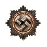 A Third Reich German Cross in gold, with 5 small domed rivets and maker’s code “2” on the flat