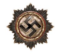 A Third Reich German Cross in gold, with 5 small domed rivets and maker’s code “2” on the flat