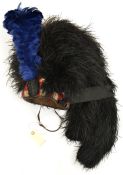 A Highland feather bonnet, two tails, diced red, white and blue wool headband, black silk tassels,