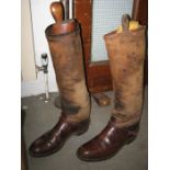 A pair of canvas and leather riding boots, 2 hoof picks, 2 webbing tool bags, a cross strap with