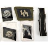 A Third Reich Bevo weave Deaths head, an SS collar patch on a portion of field grey collar; a collar