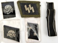 A Third Reich Bevo weave Deaths head, an SS collar patch on a portion of field grey collar; a collar