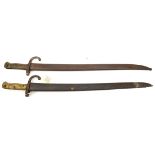 2 French 1866 Chassepot bayonets, one dated 1870, in their scabbards, one QGC, the other FC. (2)