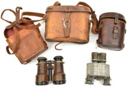 2 small military field glasses, in their cases, also a 1916 dated case for prismatic binocular.