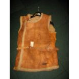 A WWII sheepskin Jerkin and gloves worn by Midshipman W.S.H. Whitehead RNVR, during voyages in the