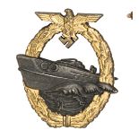A Third Reich 2nd pattern E boat badge, by Schwerin, of heavy zinc with gold lacquered wreath and