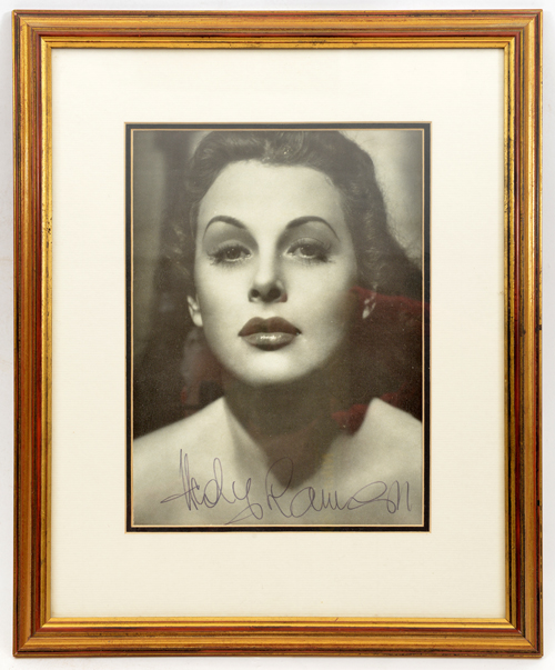 A close up head and shoulders studio photographic portrait signed “Hedi Lemaar”, well mounted and