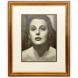A close up head and shoulders studio photographic portrait signed “Hedi Lemaar”, well mounted and
