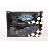 2 Minichamps 1:18 scale F1 racing cars. A Benetton F1 Playlife B199 1999, RN10, in two-tone blue and