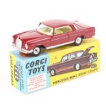 A Corgi Toys Mercedes Benz 220SE Coupe (253). An example in maroon with yellow interior. Boxed,