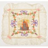 A WWI silk cushion cover “Souvenir d’Ypres”, coloured printed centre picture of Ypres in embroidered