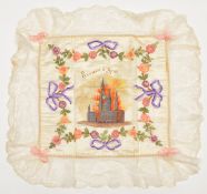 A WWI silk cushion cover “Souvenir d’Ypres”, coloured printed centre picture of Ypres in embroidered