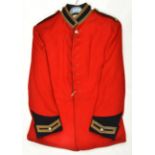 A post 1953 Life Guards trooper’s scarlet tunic, blue facings with gilt lace trim, anodised