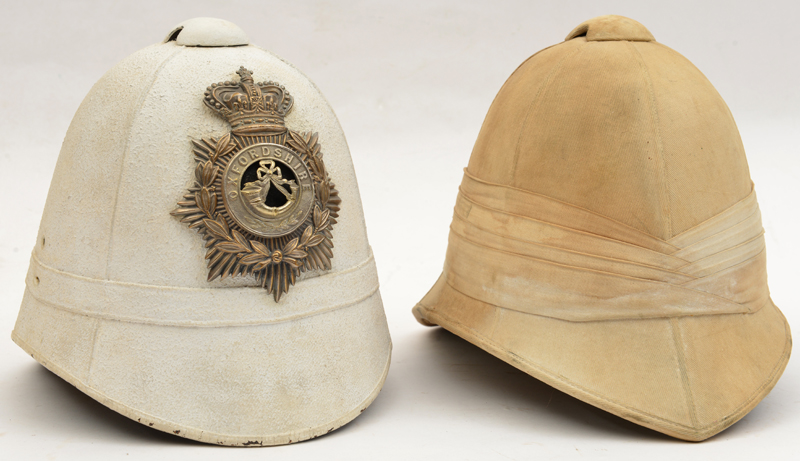 A tattoo tropical helmet, (hole to crown, chin strap missing); a police helmet coated with white