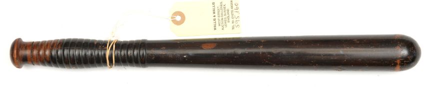 A 19th century varnished turned wood truncheon, ribbed grip. GC