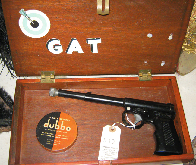 A .177” Gat pop out air pistol, by Harrington & Son, of black lacquered all metal construction.