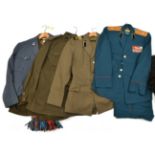 2 Soviet Russian officers’ uniforms, each includes trousers; a Soviet NCOs brown tunic; 1 other SD