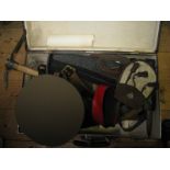 A WWII British entrenching tool, a similar US entrenching tool, a Mannlicher Carcano Mod 1938