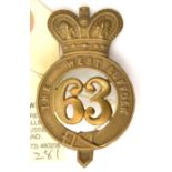 An OR’s 1874 pattern brass glengarry badge of The 63rd (West Suffolk) Regt (525), copper lugs. GC