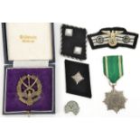 A Third Reich die struck Cossack badge; an Eastern Peoples award 2nd class with swords; SS collar