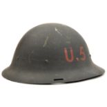 A scarce WWII period Eastern European steel helmet, raw edged with 3 slots for camouflage netting