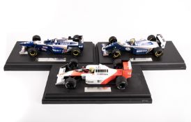 3 Paul’s Model Art (Minichamps) LANG 1:18 scale F1 racing cars on display plinths. A ‘Pole Position’