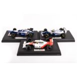 3 Paul’s Model Art (Minichamps) LANG 1:18 scale F1 racing cars on display plinths. A ‘Pole Position’