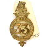 An OR’s 1874 pattern brass glengarry badge of The 33rd (The D. of Wellington’s) Regt, (478),