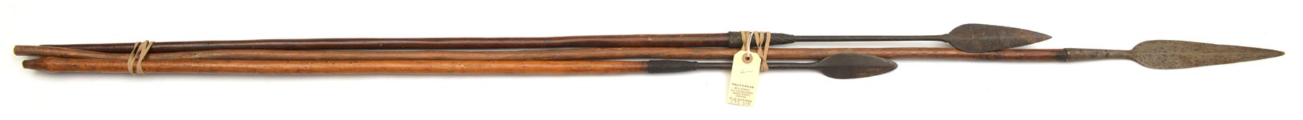 A Zulu throwing spear, steel wire bound, 51” overall; another similar steel wire bound 43” overall
