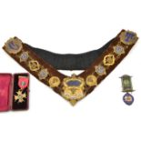 An RAOB gilt and enamelled linked sash with brown velvet lining, an HM silver gilt and enamel
