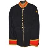 A bandsman’s tunic of the Blues and Royals, post 1953, blue with scarlet facings, gilt braid trim,