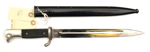 A Third Reich parade bayonet, plated blade 9¾”, by WKC, the plated hilt with bird’s head pommel