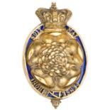 An early 19th century officer’s gilt badge of The 7th (or Royal Fusiliers), the Rose within an