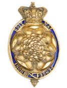An early 19th century officer’s gilt badge of The 7th (or Royal Fusiliers), the Rose within an