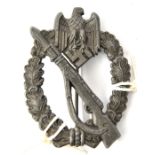 A Third Reich Infantry Assault badge, originally bronzed (?) and with no trace of maker’s mark. GC