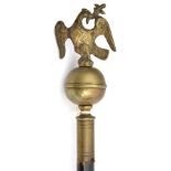 A religious staff with brass ball top surmounted by eagle, haft reduced to 37”. GC